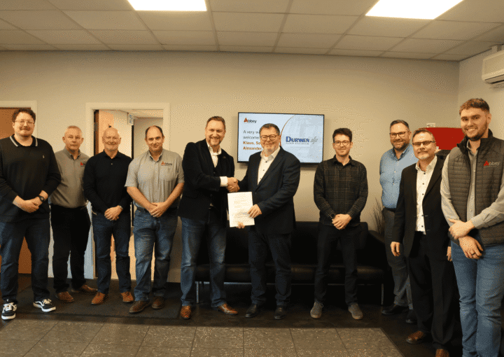 the staff of abbey and and durwen are holding up a partnership agreement
